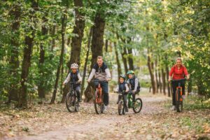 photo of a family cycling on bike trails in Dorset forests