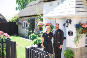 Photo of English Cottage Vacation co-hosts Laura and Nathan who used the power of the Law of Attraction to succeed against all odds