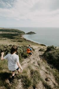 photo of hikers on walking vacations in Dorset taking the South West Coastal Path