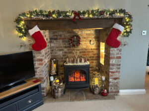Photo of the inglenook fireplace in the cosy snug at English Cottage Vacation's enchanting Well Cottage