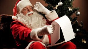 photo of Santa Claus reading his list of naughty and nice