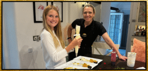 Laura with a young guest in Well Cottage kitchen